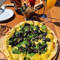 Vegan option of the Bannockburn pizza, plus mimosa at Vogel St Kitchen in Dunedin