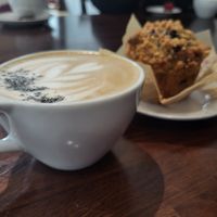 Black sesame latte with blueberry muffin at Three Cats Coffee in Woodinville