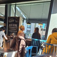 It has tables to enjoy your meal at Greggs - 421 Strand in London