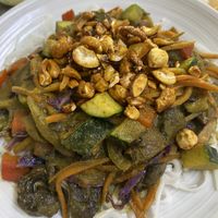 Green curry veggies over rice noodles   at Island Naturals Cafe in Seven Mile Beach