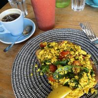 Turmeric tofus scramble, iced long black and berry mango smoothie  at Burnt Toast in Cape Woolamai