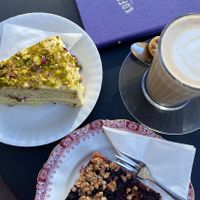 Pistachio cake (not vegan) and berry crumble cake (vegan). Both delicious !  at Koffiehuisje Eindhoven in Eindhoven