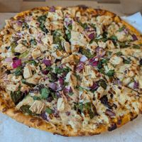 Plant based butter chicken pizza at Pizza Twist - N Euclid Ave in St Louis