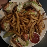 Vegan club sandwich with fries  at Handlebar in Chicago