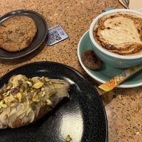 Oat cookie (too sweet), kurkuma latte with oatmilk (nice) and pistachio croissant (nice, but with no filling, only a topping)  at Anne&Max - Domstraat in Utrecht