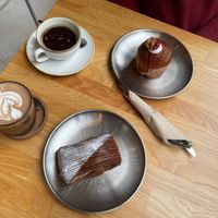 Cheesecake raspberry croissant and Dubai chocolate paine suisse, Mocchaccino and coffee at Magma Bakery Lab  in Barcelona