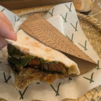 Tapioca with hummus tahini, sundried tomatoes, marinated red onion and rocket. Sorry, I started eating it before photographing it! at Tapí Tapioca - Loja Centro  in Rio De Janeiro