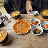 Kimchi stew (with eggs (ask to omit if you'd prefer without) and kimchi pancake. at Sinbaengi Kimchi in Jeonju