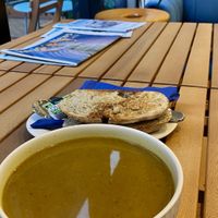 Vegan golden soup with sourdough and vegan butterr  at Creamy & Crunchy  in Wellington