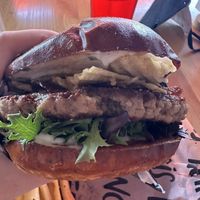 Pub grub special with juicy Lucy, sour cream, pickles and potato chips on a pretzel bun.   at Francis Burger Joint  in Minneapolis