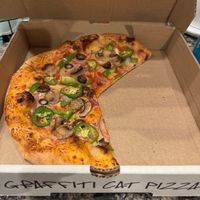 Forgot to snap the picture before digging into it (hard to restrain myself).  This is the “Veggie Veggie Veggie“, with vegan cheese and added Jalapeño, my go-to order.  So good! at Graffiti Cat Pizza in Occoquan