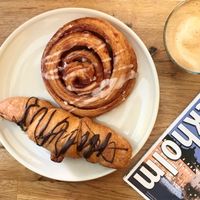 Kannelbun and croissant with a chocolate drizzle at Sattva Naturbageriet in Stockholm