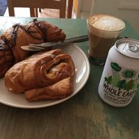 Chocolate croissant, apple and vanilla pastry, oat milk cappuccino and elderflower  at Sattva Naturbageriet in Stockholm