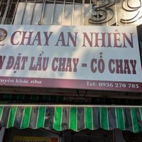 Restaurant name on top of the doorway at Chay An Nhiên Vegan Food in Hanoi
