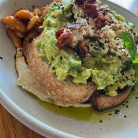 Avo on toast with baked beans   at Sister of Soul in St Kilda