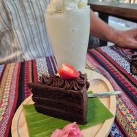 Chocolate cake with banana smoothie. at Baanrainaifun Organic Garden in Chiang Mai
