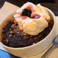 Baked chocolate tart with cream at Von Zehn bis Vier at Academy Bar in Salzburg