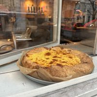 Cheesecake cooling in the window  at Von Zehn bis Vier at Academy Bar in Salzburg