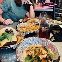 Delicious veggie burger with vegan cheese (far left), garlic fries with vegan aioli (middle), and the “Hulk” toco with seitan (front). at Yellow City Street Food - YCSF in Amarillo
