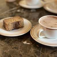 Keke de plátano with Hot chocolate (made with soya milk)  at Pasteleria San Antonio in Lima