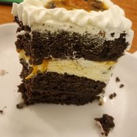 Bolo mousse de maracujá (com um pedaço já comido). at Loving Hut - Vila Mariana in Sao Paulo