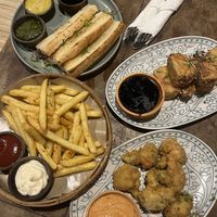 (Top left to bottom right) Bread and Dips, Crispy Tofu, Fries (mayo not vegan), Vegan Popcorn Chicken  at The Shack Restaurant and Bar in 