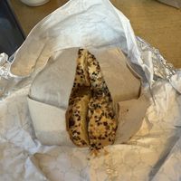 Vegan breakfast sandwich with everything bagel and vegan scallion cream cheesee  at Goldstein's Bagels & Bialys in Boise