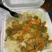 Curry tofu w/ white rice (I ate some before pic)   at Ionie's Carribbean Kitchen in Grayson