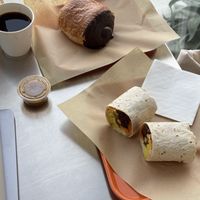 black coffee, vegan chocolate croissant, vegan breakfast burrito  at mu.sō coffee  in Los Angeles