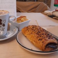 Coffee and pain au chocolate at Black Cat Santiago in Santiago De Compostela