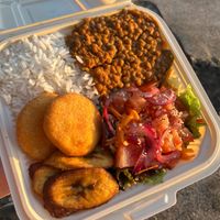 Lentil Curry with rice, plantains, arepitas, and salad. 

 at vegantamarindo in Tamarindo