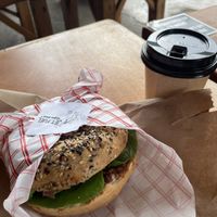 Bagel with americano  at Jet Fuel Coffee Shop in Jaco