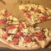 The same delicious Vegan White pizza, shifted to the other side of the box to show the oil that seeped through.  at Este Pizza - downtown SLC in Salt Lake City