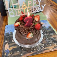 The cake in all her decorated glory- they can write on the cakes and do other tweaks to  cakes if requested😄  at Kynd Cakery in Sunshine Coast