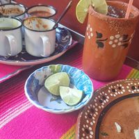 Una Mezcalita refrescante y salsitas para acompañar at DeAca Restaurante in Mexico City