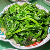 Sauteed Snow pea shoots at Café China - 傾國傾城 in New York City