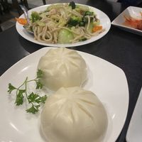 Steamed buns & very garlic fried noodle in background- obsessed   at Veggie Garden in Mountain View