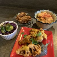 Cabbage and sprouts, avocado nuggets, cauliflower curry tofu and cauliflower with charcoal sauce at Base Island Kitchen in Osaka