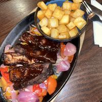 Sizzling vegan ribs with barbecue sauce, roasted veg and diced potatoes   at The Clay Pipe Inn  in Poole