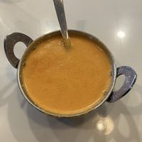 Coconut Bell Pepper Soup (roasted bell pepper with coconut cream). Thick & creamy with notes of warming spices. at Saffron Indian Grill & Bar in Eagan