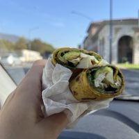 Piadina con impasto alla curcuma. Ripiena di tofu marinato, zucchine grigliate e patè di olive  at Capre e Cavoli in Brescia