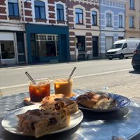 Olive focaccia, vegan pastry, and iced oat latte + americano!  at MAINS  in Uccle