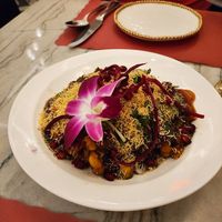 Samosa Chaat without yogurt was good we liked the crunchy noodles on top and edible flower at Red Chilli  in Jackson Heights