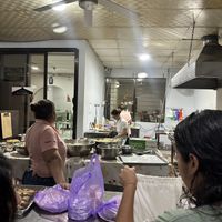 Kitchen and order counter  at Pupusería La Ceiba in Santa Ana