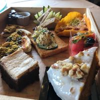 Vegan high tea set - cheesecake brownie and pumpkin carrot cake in foreground at Well Dressed Salad Bar and Cafe in Central Singapore