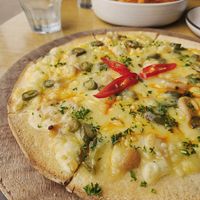 Vegan Jalapeño Pizza on GF Crust and The BEST fries on Earth. at Cabana  in Pauanui
