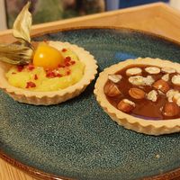 Lemon curd tart and a Toffee & hazelnut tart at All Good Things Vegan in Paignton