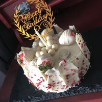 Celebration cake - white chocolate cheesecake flavour 😋with homemade white chocolate and raspberry decoration  at All Good Things Vegan in Paignton