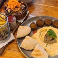 Falafel plate which came with fries and salad, and the Mediterranean bowl  at Tiki Limbo in Montanita