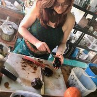 Scooping out black sapote ("chocolate pudding fruit"), to make a sinfully good chocolate sauce with natural aphrodisiacs😄Ask Eric for his secret recipe!  at La Joya Del Sol in Perez Zeldon